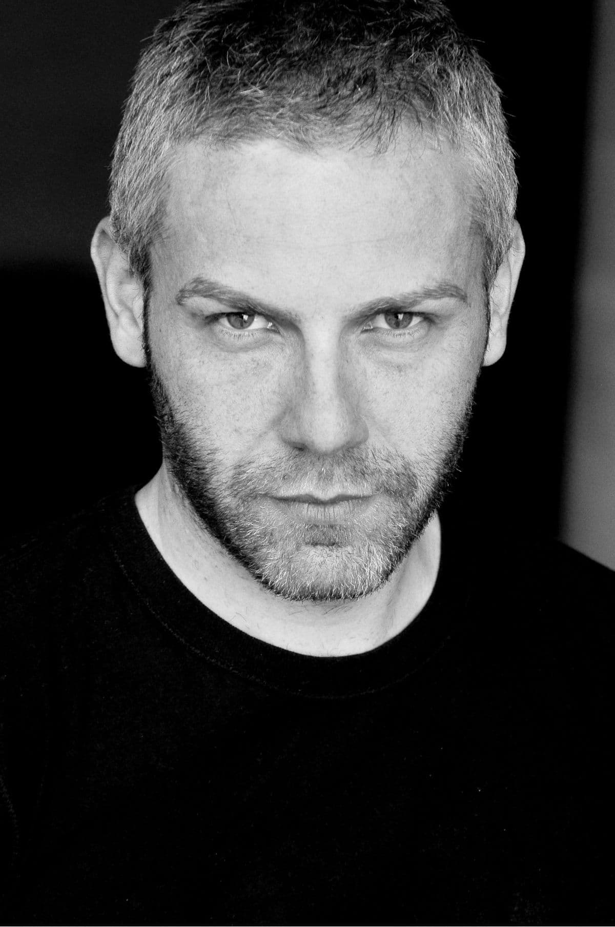 Black and white portrait photograph of this episode's guest