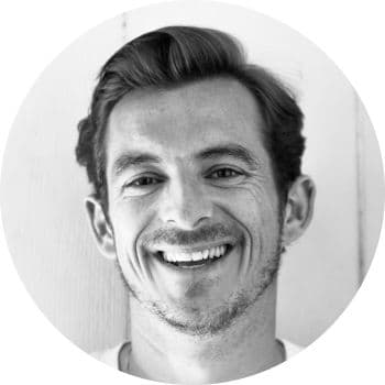 A black and white portrait photograph of Marek Sandoval